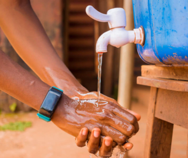 young-black-african-person-washing-his-hands-with-soap-tap-water (1)