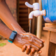 young-black-african-person-washing-his-hands-with-soap-tap-water (1)